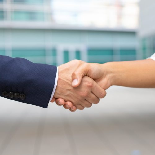 Closeup shot of business handshake. Cropped shot of two people wearing formal suits shaking hands. Business handshake concept